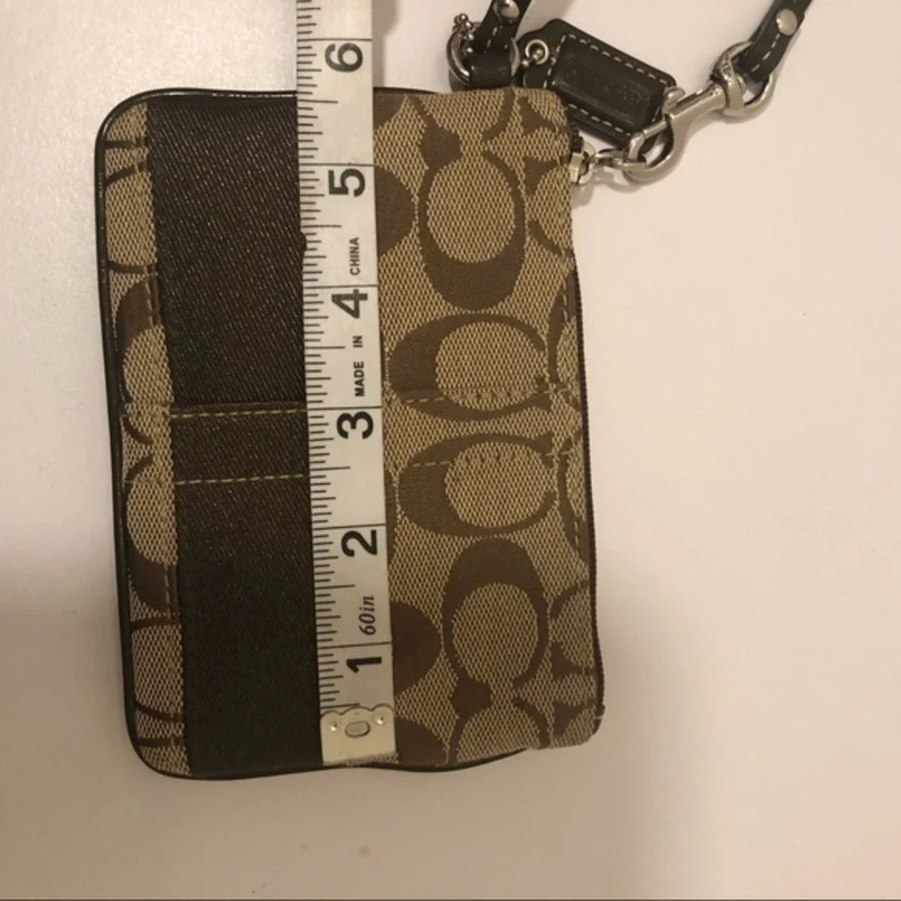 Coach brown signature striker wristlet